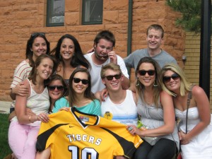 Friends of Evan Spirito gather on May 5 for the dedication of a bench in his memory.  They are holding his lacrosee jersey,  which was No. 19.