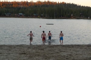 Four courageous students charge into the brisk pond after a rousing game of ultimate frisbee (left to right): Andrew Gregovich, John McCormick, Josh Feldman, and Edward Crawford (Outside temperature 40degrees Feirenheit )
