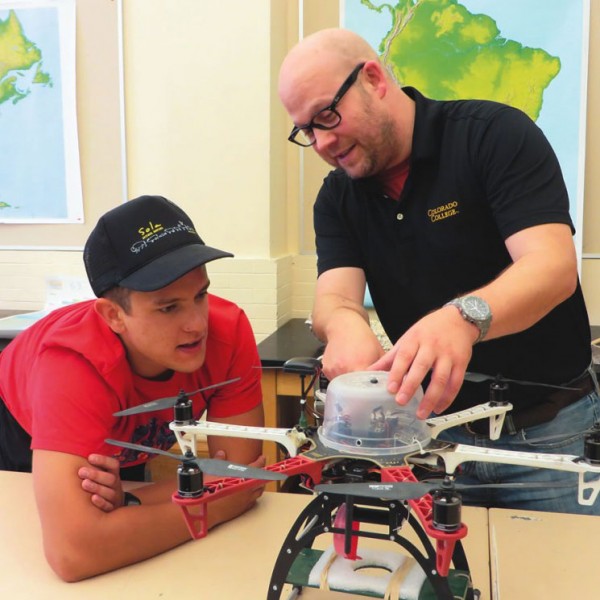 Noah Cutter ’16, left, and CC Director of Innovative Technology Matt Gottfried discuss plans for modifying one of the unmanned aerial vehicles they built as part of the new drone program that’s just taken flight. Photo by Pattye Volz