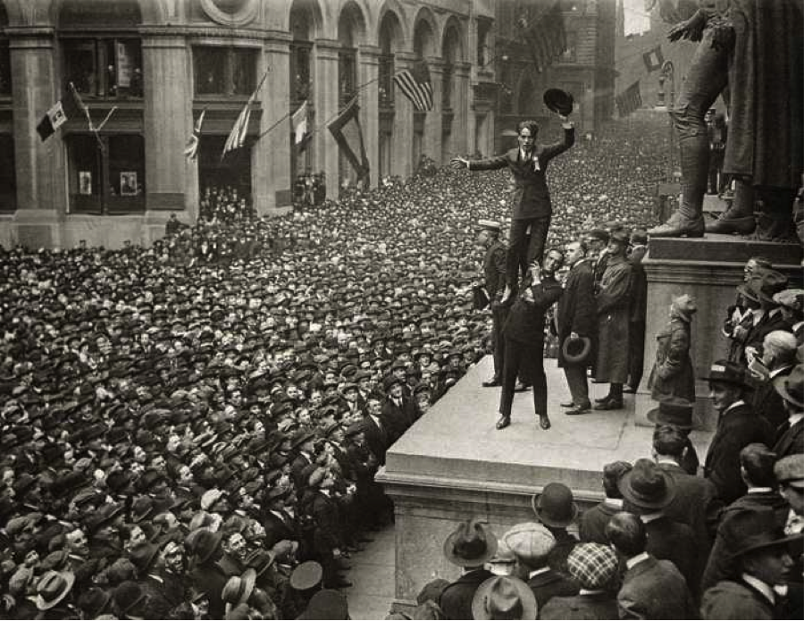 Here is a picture taken of Hollywood stars Douglas Fairbanks and Charlie Chaplin waving Liberty bonds, and the crowds that gather to see them in person. 1918. 