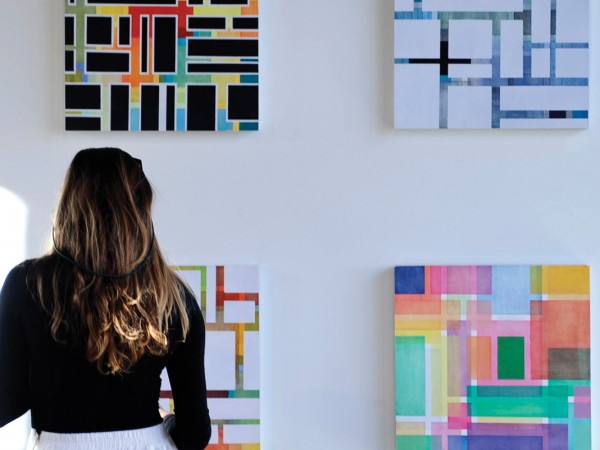 A student examines the vibrant work of Katie Patterson ’14, whose studio art thesis show is among the first events in the newly renovated 802 space, named for its address at 802 N. Nevada Ave. The building, collaboratively run by Student Life and the Art Department, serves as a student activity space, providing an intersection between the curricular and co-curricular. 802 allows for greater flexibility in scheduling creative academic arts events and senior capstone experiences such as art exhibitions, film screenings, poetry slams, spoken word events, drama and dance performances, music recitals, receptions, lectures, and readings.