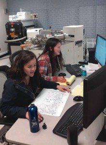 Sally Shatford ’15 and Carolyn Nuyen ’15 at work in the laser-ablation mass spectrometry laboratory at the University of Arizona during March 2014 spring break. They analyzed grains of the mineral zircon that constituted a small part of the Tava sandstone, then determined the uranium-lead age for each grain, as a step on the way to determining the formation age for the Tava formation.