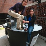 Students with the EarthTub food waste composter. Photo by Brad Armstrong.