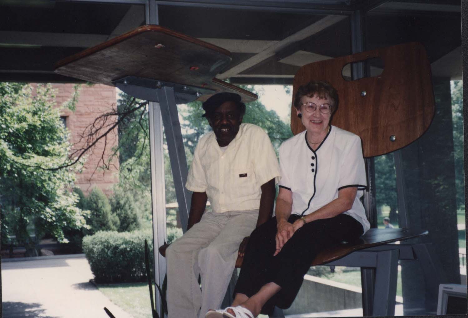Library staff Jessie Brown and Rita Edgington in the giant chair, August 1993.