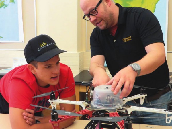 Noah Cutter ’16, left, and CC Director of Innovative Technology Matt Gottfried discuss plans for modifying one of the unmanned aerial vehicles they built as part of the new drone program that’s just taken flight. Photo by Pattye Volz