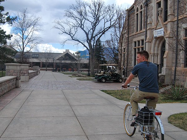 Student riding bike